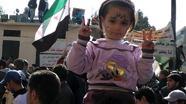 A Syrian girl gestures during a protest in the flashpoint city of Homs, Syria, Feb. 3, 2012. 