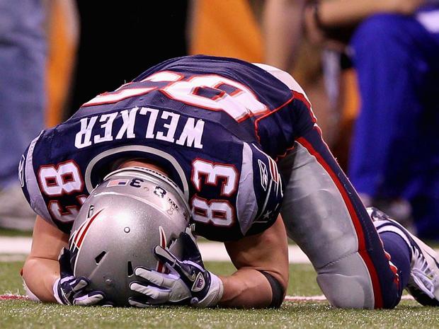 Wes Welker lays on the ground 