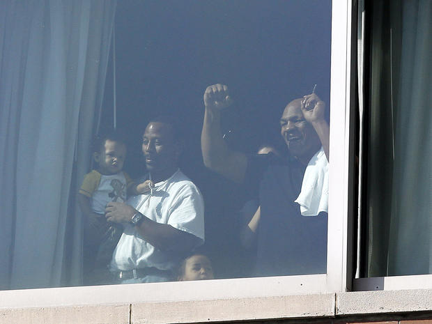 Mike Tyson looks out the window of a high rise near Battery Park 