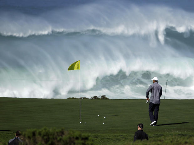 Tiger Woods walks to his ball on the 15th green of Pebble Beach  
