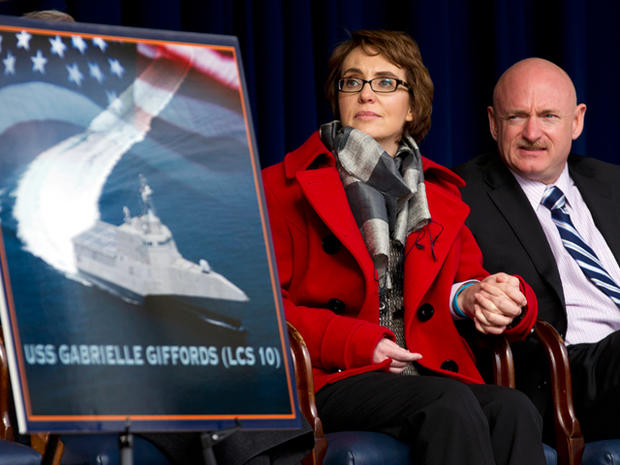 Former Arixona Rep. Gabrielle Giffords and her husband Mark Kelly, attend a ceremony at the Pentagon, Friday, Feb. 10, 2012, for the unveiling of the USS Gabrielle Giffords. The Navy has named a ship for Gabrielle Giffords, the recently retired congresswoman from Arizona who is recovering from a gunshot wound to the head received in January 2011. 