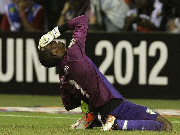 Boubacar Barry reacts during a penalty shoot-out against Zambia  