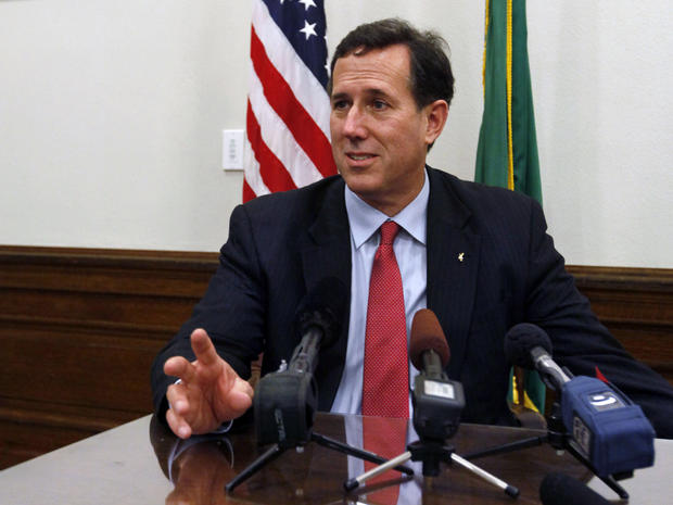 Rick Santorum answers questions at a news conference in Olympia, Wash. 