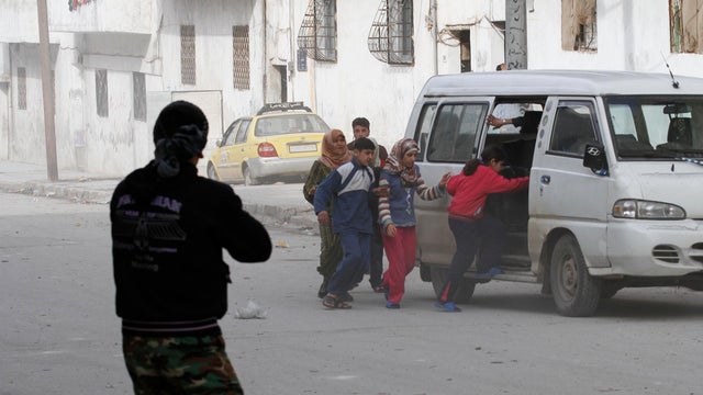 Civilians flee fighting after Syrian army tanks enter the northwestern city of Idlib 