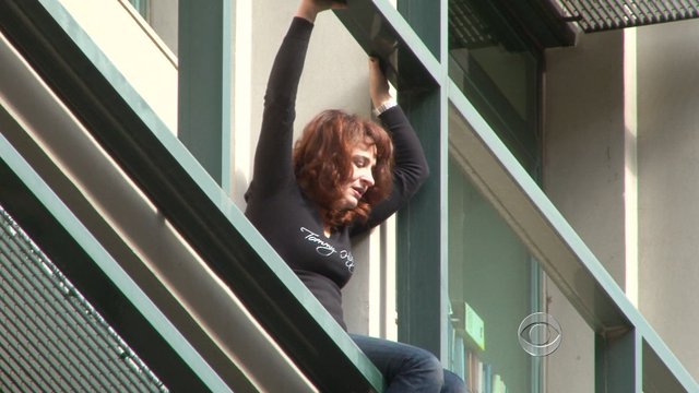 Lambrousia Harikleia climbed onto the balcony of her  office building in Athens on Feb. 15, 2012. 