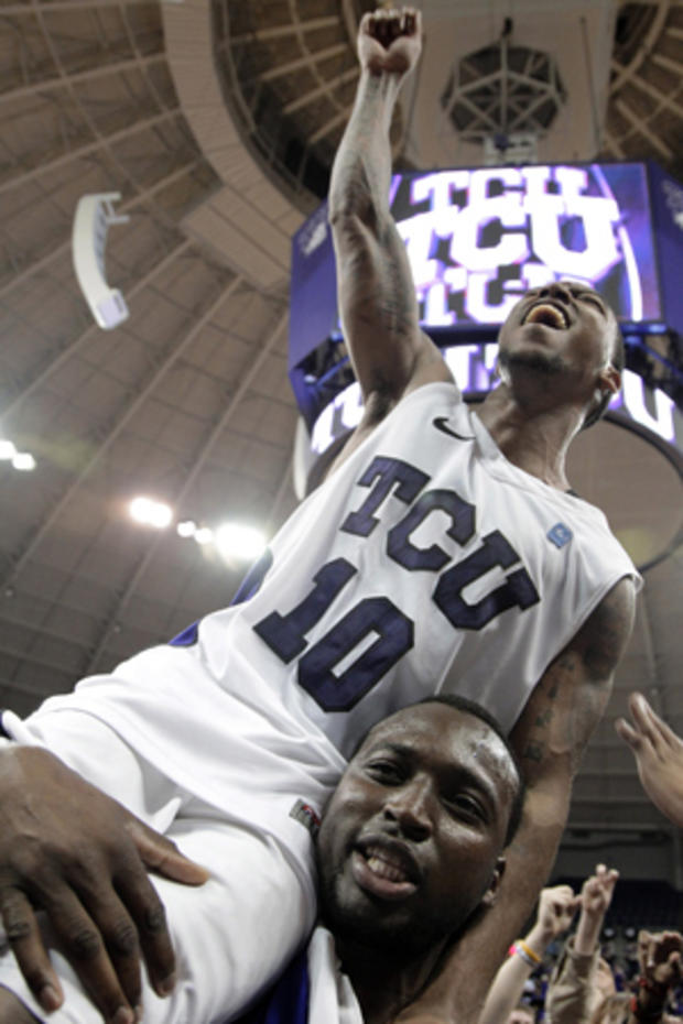 TCU's Hank Thorns  is carried off the court  