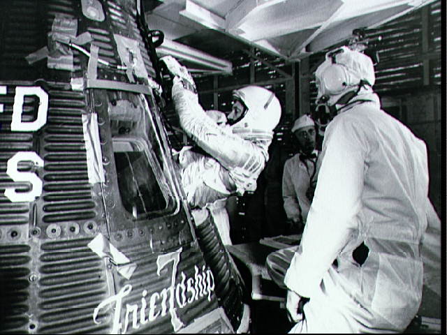 Glenn_gets_in_capsule_prior_to_launch_-_NASA.jpg
