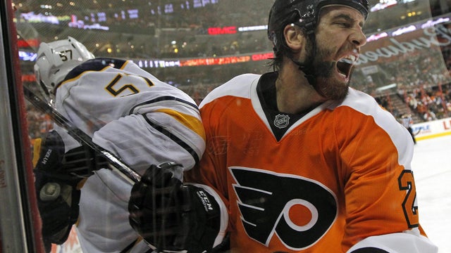 Maxime Talbot reacts after colliding with Tyler Myers 