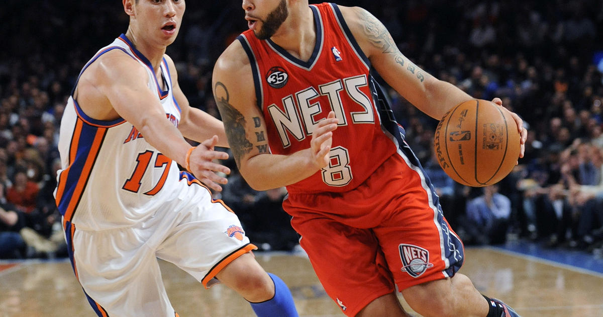 A customer wearing a T-shirt of New York Knicks Jeremy Lin poses