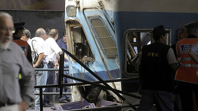 Police and rescue workers surround a train that crashed at Once train station in Buenos Aires on February 22, 2012.  