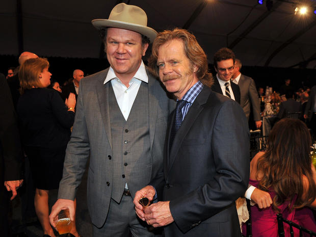 John C. Reilly, left, and William H. Macy pose in the audience at the Independent Spirit Awards  
