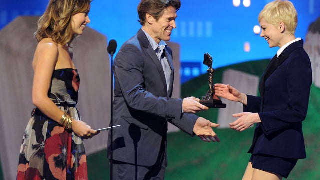 Fr Olivia Wilde and Willem Dafoe present the best female lead award to Michelle Williams for "My Week With Marilyn" 