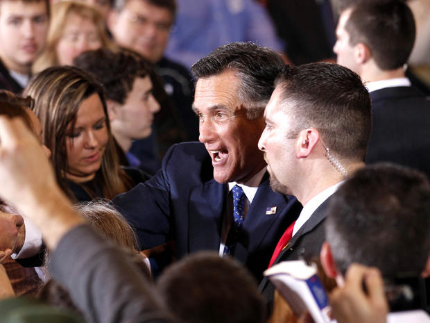 Mitt Romney greets supporters after winning the Michigan primary 