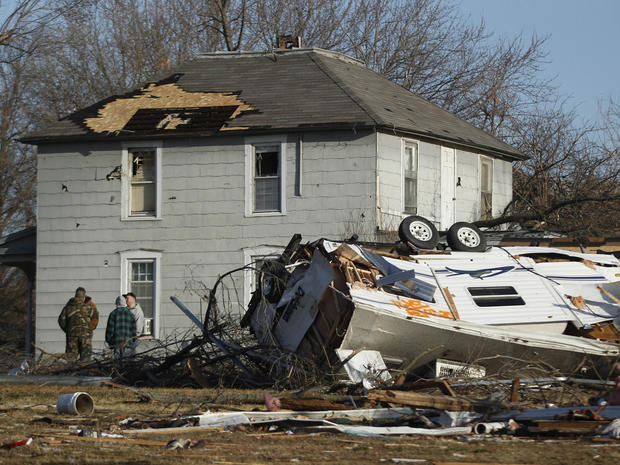 Residents gather the morning after severe storms destroyed several homes  