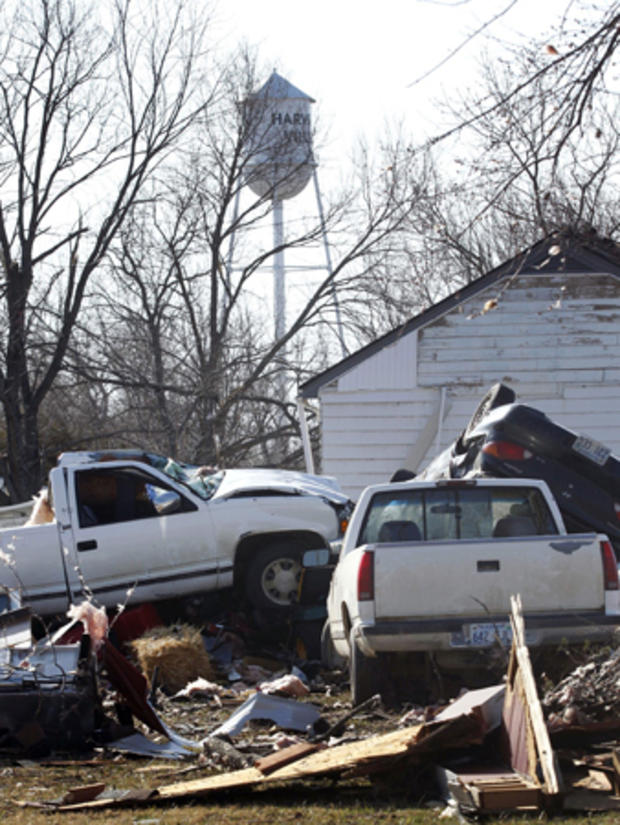 Damaged vehicles are piled together the morning after severe storms 