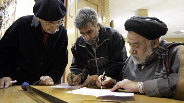 Iranians fill in their ballots for parliamentary elections 