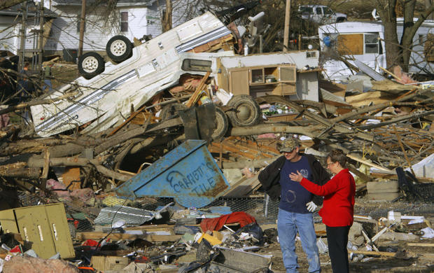 People try to salvage what they can after a tornado destroyed homes  