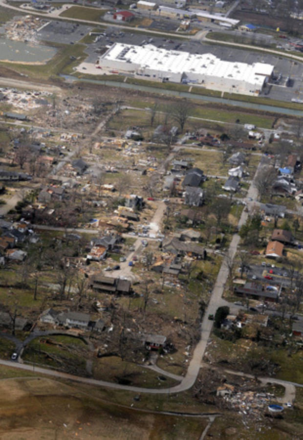 aerial photo shows a path of damage stretching west from the backside of a Wal-Mart Supercenter 