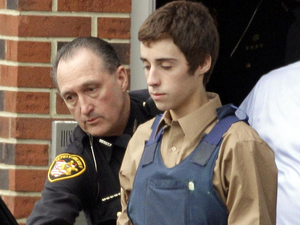 Seventeen-year-old TJ Lane is led from Juvenile Court by sheriff's deputies in Chardon, Ohio, Feb. 28, 2012, after his arraignment in the shooting of five high-school students. 
