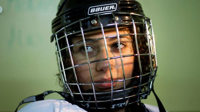 Druse Arab Maya al-Yousef, 13 and a member of the Canada-Israel Hockey School, wears her helmet prior to a training session in Metulla, Israel, on the border between Israel and Lebanon Feb. 27, 2012. A rare Arab-Jewish ice hockey team in Israel is breakin 