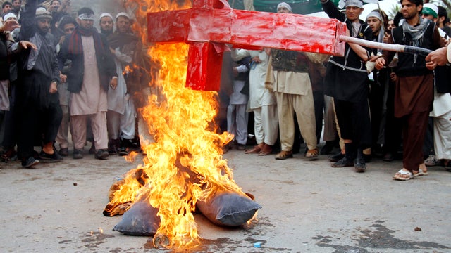 Afghans burn an effigy depicting President Obama during a protest March 13, 2012, in Jalalabad, Afghanistan, following the killings of civilians allegedly by a U.S. soldier in Panjwai. 