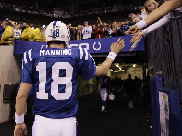 Peyton Manning walks off the field  