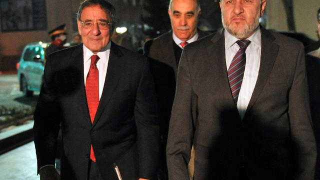 Secretary of Defense Leon Panetta walks with Afghan Interior Minister Besmullah Mahammadi in Kabul, Afghanistan, March 14, 2012. 