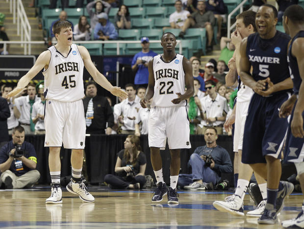 Jack Cooley and Jerian Grant react as Xavier's Dezmine Wells celebrates 