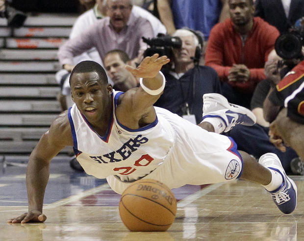 Jodie Meeks, left, dives for a loose ball  