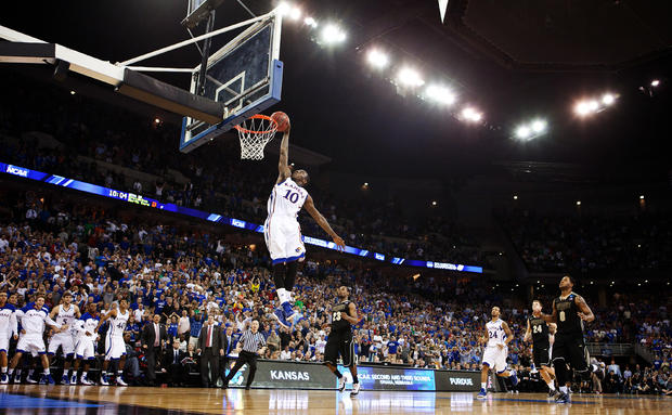 Tyshawn Taylor dunks the ball in the final seconds  