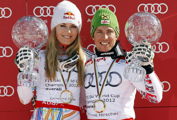 Lindsey Vonn and Marcel Hirscher pose with World Cup overall trophies 