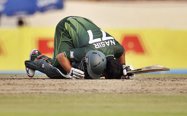 Nasir Jamshed bows his head to touch the ground to celebrate  