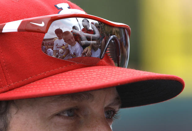 Fans are seen reflected in David Freese sunglasses  
