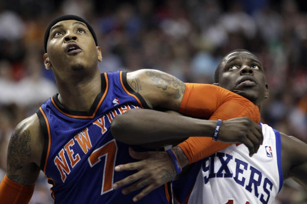 Carmelo Anthony and Jrue Holiday struggle for position  