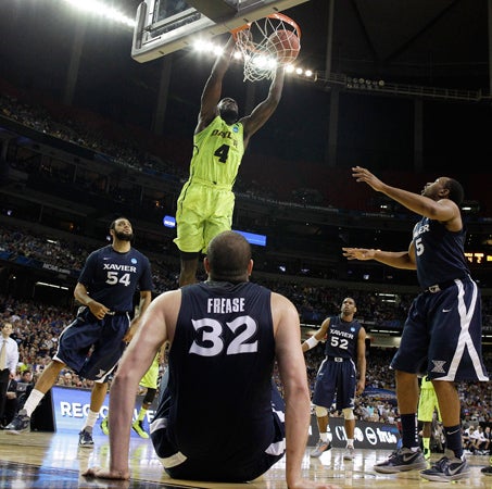 Quincy Acy dunks the ball 