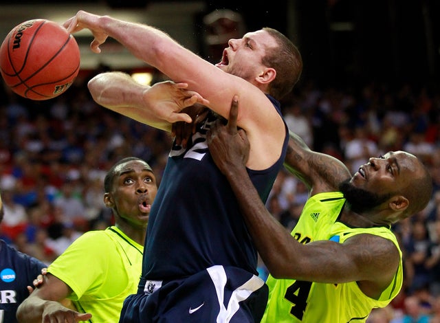 Kenny Frease works against Quincy Acy  