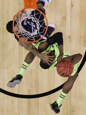 Justin Martin defends as Quincy Acy shoots  