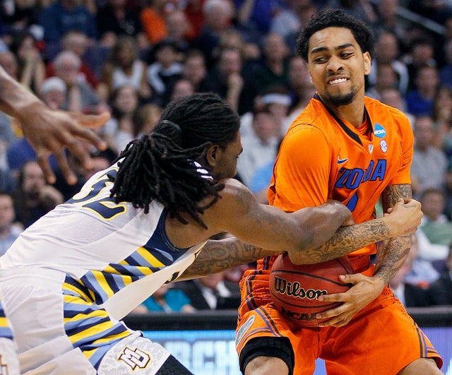 Jae Crowder and Mike Rosario tussle for the ball 