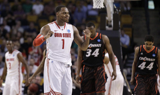 Deshaun Thomas celebrates in front of Yancy Gates and JaQuon Parker 
