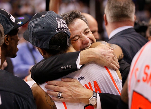 Rick Pitino hugs his player Peyton Siva after his team defeated Florida 72-68  
