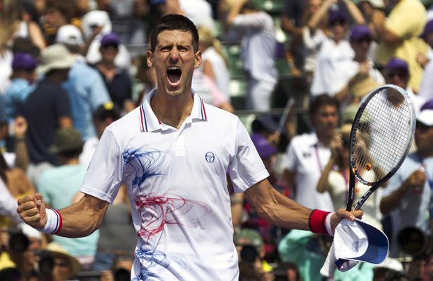 Novak Djokovic reacts after defeating Andy Murray 