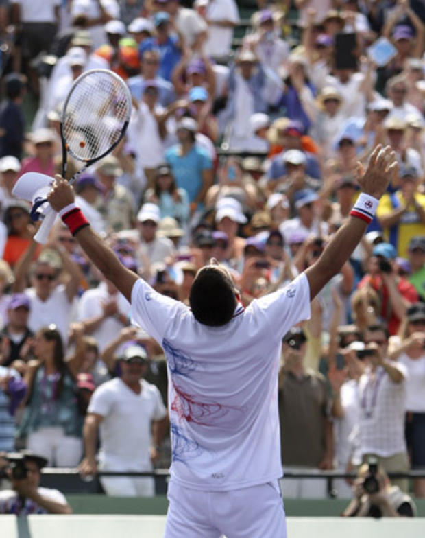 Novak Djokovic celebrates after defeating Andy Murray 
