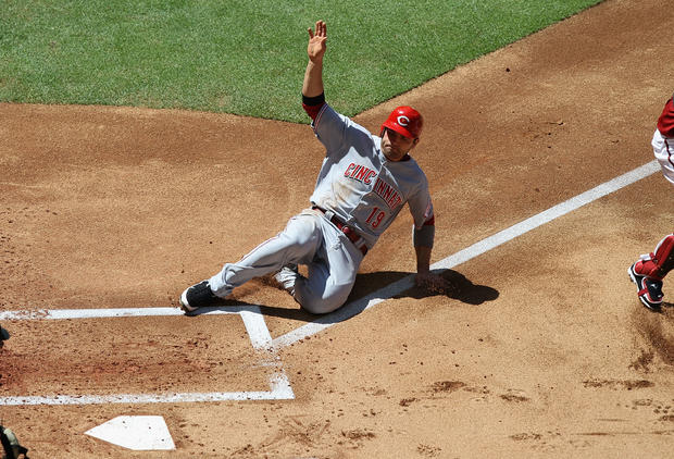 Joey Votto slides in to score  