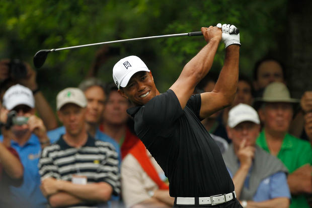 Tiger Woods hits a tee shot during a practice round  