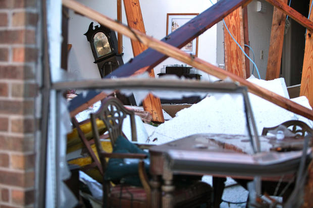 A house is a mass of debris after a tornado struck 