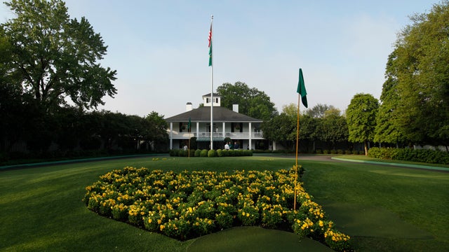 The sun rises over the Augusta National Golf Club house 