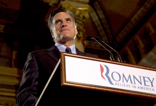 Gov. Mitt Romney pauses while speaking at a primary election night rally 