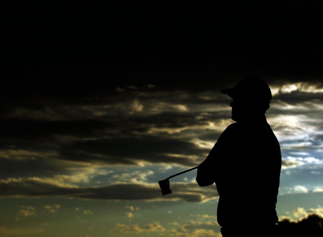 Peter Hanson, of Sweden, waits to putt on the 18th during the first round  