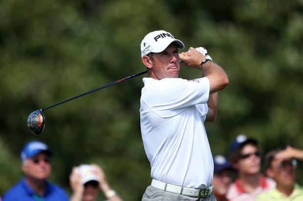 Lee Westwood of England hits a tee shot on the 10th hole 