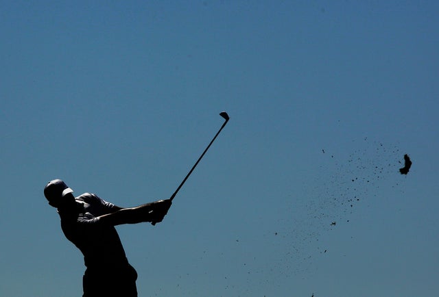 Tiger Woods tees off on the fourth hole  
